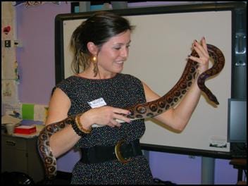 Teacher handling a snake