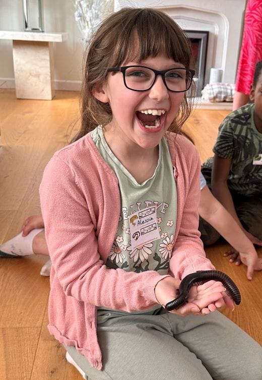 Girl with a gecko on her shoulder